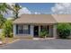 Inviting single-story home featuring blue shutters, a cozy front entrance, and well-maintained landscaping at 333 Bay Pl, Safety Harbor, FL 34695