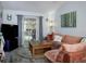 Spacious living room featuring wood floors and access to the lanai, ideal for relaxing and entertaining at 333 Bay Pl, Safety Harbor, FL 34695