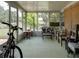 Enclosed sunroom with neutral decor and views of the beautifully landscaped yard at 333 Bay Pl, Safety Harbor, FL 34695