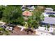 Aerial view of the property surrounded by mature trees and a well-maintained landscape at 341 14Th Ave Ne, St Petersburg, FL 33701