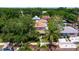 Aerial view of the property showcasing lush greenery, surrounding trees and a charming neighborhood at 341 14Th Ave Ne, St Petersburg, FL 33701