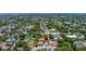 An aerial view shows lush trees, surrounding the neighborhood, and other nearby neighborhoods at 341 14Th Ave Ne, St Petersburg, FL 33701