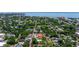 A bird's eye view of the property showcasing its location within a tree-lined neighborhood near the ocean at 341 14Th Ave Ne, St Petersburg, FL 33701