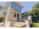 Outdoor grill on a backyard patio next to a two-story home and garden at 341 14Th Ave Ne, St Petersburg, FL 33701