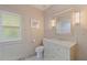 Bright bathroom features a tiled floor, and a vanity with a marble countertop at 341 14Th Ave Ne, St Petersburg, FL 33701