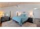 Bright bedroom with high ceilings, ceiling fan, wood floors, and ensuite bathroom at 341 14Th Ave Ne, St Petersburg, FL 33701