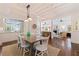 Dining area with hardwood floors and an open floor plan to the kitchen and living room at 341 14Th Ave Ne, St Petersburg, FL 33701