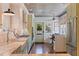 Charming kitchen with custom cabinets, stainless steel appliances, breakfast nook, and wood-paneled ceiling at 341 14Th Ave Ne, St Petersburg, FL 33701