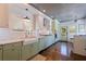 Stylish kitchen with farmhouse sink, marble countertops, stainless steel appliances, and wood-paneled ceiling at 341 14Th Ave Ne, St Petersburg, FL 33701