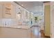 Bright kitchen with marble countertops, farmhouse sink, stainless steel appliances, and wood-paneled ceiling at 341 14Th Ave Ne, St Petersburg, FL 33701