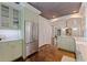 Spacious kitchen with stainless steel refrigerator, custom cabinets, and access to dining area at 341 14Th Ave Ne, St Petersburg, FL 33701
