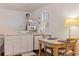 Bright kitchenette featuring marble countertops, open shelving, and a wooden dining table at 341 14Th Ave Ne, St Petersburg, FL 33701