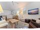 Inviting living room with a flat-screen TV, comfortable seating, and a kitchenette nearby at 341 14Th Ave Ne, St Petersburg, FL 33701