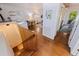 Open-concept living area showcasing hardwood floors, a dining table, and stairs to another floor at 341 14Th Ave Ne, St Petersburg, FL 33701