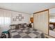 Cozy bedroom with a comfortable quilt, closet space, and natural light from the window at 34125 Chancey Rd, Wesley Chapel, FL 33543
