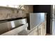 Close-up of kitchen featuring a stainless steel farmhouse sink and modern appliances at 3722 Binnacle Dr, Tampa, FL 33611