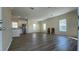 Spacious living area with wood-look floors, ample natural light, and neutral wall paint at 3722 Binnacle Dr, Tampa, FL 33611
