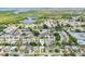 Overhead image of a neighborhood highlighting a specific home's location, community layout, and nearby amenities at 3813 Luma Dr, Holiday, FL 34691
