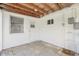 Enclosed back porch with concrete floors, a door, and a window at 3813 Luma Dr, Holiday, FL 34691