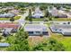 Overhead image featuring a house with a spacious backyard and patio, surrounded by mature trees in a residential area at 3813 Luma Dr, Holiday, FL 34691