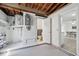 Unfinished basement featuring a bathroom and view to the dining room at 3813 Luma Dr, Holiday, FL 34691