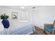Bedroom with a closet with large doors, wood floors, neutral walls, and cozy decor at 3813 Luma Dr, Holiday, FL 34691