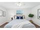 Bedroom with wood floors, neutral walls, a ceiling fan, and cozy decor at 3813 Luma Dr, Holiday, FL 34691