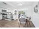 Kitchen with hardwood floors and stainless steel appliances, blending style and functionality for an inviting home at 3813 Luma Dr, Holiday, FL 34691