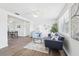 Inviting living room showcasing stylish decor, hardwood floors, and lots of natural light at 3813 Luma Dr, Holiday, FL 34691