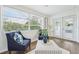 Bright living area features neutral walls, wood floors, lots of windows, and modern furnishings at 3813 Luma Dr, Holiday, FL 34691