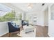 Inviting living room has natural light, wood floors, and neutral decor at 3813 Luma Dr, Holiday, FL 34691