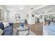 Open living area with hardwood floors leading into a modern kitchen and dining space at 3813 Luma Dr, Holiday, FL 34691