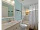 Bathroom with a single sink vanity, tub with shower, and natural light at 4022 Valrico Grove Dr, Valrico, FL 33594