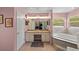 Bathroom with double sink vanity, soaking tub, and natural light at 4022 Valrico Grove Dr, Valrico, FL 33594