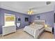 Bedroom featuring natural lighting, decorative lighting, and light purple walls at 4022 Valrico Grove Dr, Valrico, FL 33594