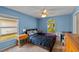 Comfortable bedroom with a large window providing natural light at 4022 Valrico Grove Dr, Valrico, FL 33594