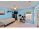Bedroom with a bed, computer desk, ceiling fan, and natural light at 4022 Valrico Grove Dr, Valrico, FL 33594
