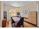 Cozy dining room with hardwood floors and a large window, perfect for Gathering meals at 4022 Valrico Grove Dr, Valrico, FL 33594