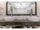 Bathroom featuring a dual vessel sink vanity with dark wood base and white subway tile backsplash at 4915 Pennsbury Dr, Tampa, FL 33624