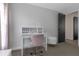 Cozy bedroom features a modern desk and chair, complemented by neutral walls and plush carpeting at 4915 Pennsbury Dr, Tampa, FL 33624