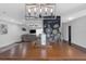 Open dining area with chalkboard wall, modern lighting, and view into the living room at 4915 Pennsbury Dr, Tampa, FL 33624