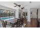 Dining area view of the kitchen and enclosed pool area at 4915 Pennsbury Dr, Tampa, FL 33624