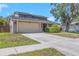 This two-story home offers a well-maintained lawn and inviting curb appeal with its neutral color palette at 4915 Pennsbury Dr, Tampa, FL 33624