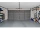 Spacious garage with ample storage space, epoxy floor, and an electric vehicle charging station at 4915 Pennsbury Dr, Tampa, FL 33624