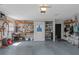Organized garage space featuring ample storage, work bench, and functional layout for various projects at 4915 Pennsbury Dr, Tampa, FL 33624