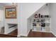 Organized hallway nook featuring shelving for storage and artistic wall decorations at 4915 Pennsbury Dr, Tampa, FL 33624