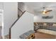 Inviting living room featuring a staircase, comfortable seating, stylish decor and beautiful flooring at 4915 Pennsbury Dr, Tampa, FL 33624