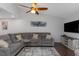Comfortable living room featuring a plush gray sectional sofa and stylish decor at 4915 Pennsbury Dr, Tampa, FL 33624