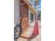 Inviting outdoor shower with wood door and privacy curtain, next to the pool and patio at 4915 Pennsbury Dr, Tampa, FL 33624