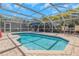 Private backyard pool area offers a relaxing escape with a screened enclosure and comfortable seating at 4915 Pennsbury Dr, Tampa, FL 33624